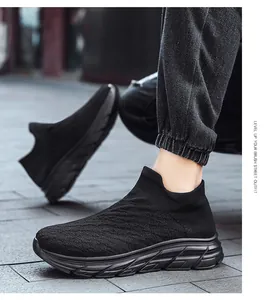 Close-up of black breathable mesh knit sneaker with durable anti-slip thick sole