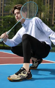 Detail of indoor badminton shoes featuring rotary knob lacing and non-slip rubber soles