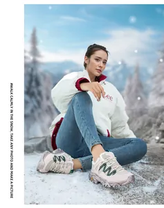 Winter outdoor hiking boots for women with warm faux shearling lining in snowy landscape