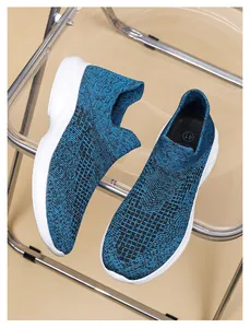 Close-up of blue knit mesh texture and size 41 detail on lightweight slip-on walking shoe