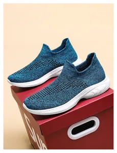 Close-up of blue and black knit slip-on sneaker with lightweight EVA sole and sock-like collar