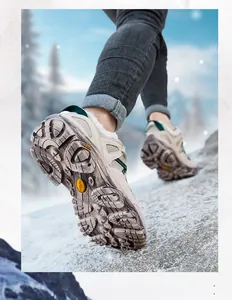 Low-angle shot of durable anti-slip hiking shoe sole on snow with warm fleece lining