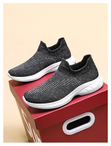 Detailed macro view of black knit sneaker mesh fabric and thick white shock-absorbing sole
