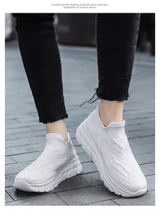Close-up of white breathable fly-knit slip-on sneakers for men with thick soles