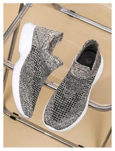 Close-up of breathable knit sock sneaker texture with lightweight white sole in size 41