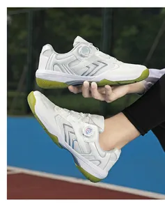 Detail view of white athletic shoes with rotating buckle system and anti-slip rubber outsole