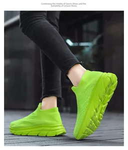 Dynamic view of neon green knitted slip-on sneakers with breathable mesh and thick soles