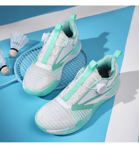 Detailed top view of white training shoes with breathable mesh and green geometric lines