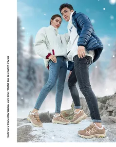Outdoor couple wearing khaki winter hiking boots with warm fleece lining and thick non-slip soles