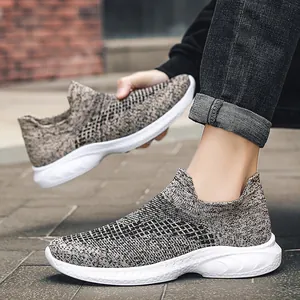 Breathable knit walking shoes with thick white sole shown on feet in outdoor setting