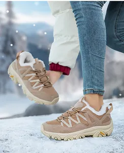 Detail of winter outdoor hiking shoe featuring plush fleece lining and durable suede upper