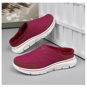 Detail view of burgundy winter slippers with thick plush lining and sport wedge sole