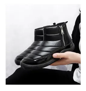 Detail of black winter boots with quilted fabric, side zipper and warm faux fur lining