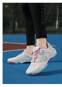 Detail of indoor badminton shoes featuring rotary buckle laces and breathable mesh fabric