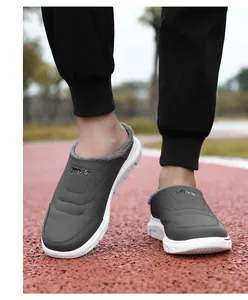 Detail view of plush lining and gray upper material of winter slip-on thermal shoes