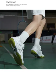 Detail of badminton shoe with swivel buckle and lime green sole on indoor court