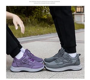 Outdoor close-up of lightweight walking shoes with magic tape and thick EVA soles