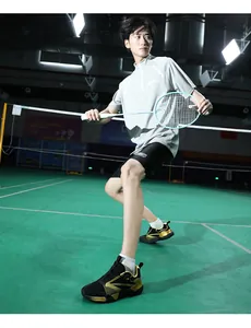 Close-up of black and gold table tennis shoes with breathable mesh for pro training
