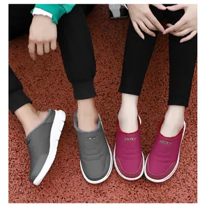 Detailed top view of couple's winter warm slip-on shoes with soft plush lining and sport soles