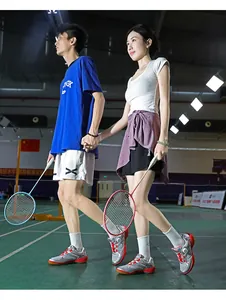 Detail of silver badminton shoes with red accents and convenient rotary buckle system