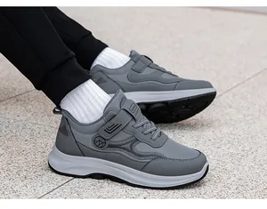 Close-up of grey walking shoes with breathable mesh, velcro straps, and durable soles