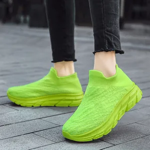 Fluorescent green knit walking shoes for men featuring breathable mesh and thick soles