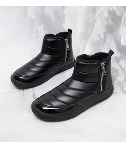 Close-up of black winter snow boot showing quilted fabric and plush faux fur lining detail