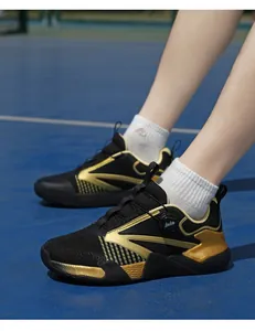 Detail of black and gold table tennis shoes with a quick-adjust rotary dial buckle system