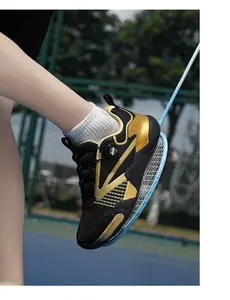 Close-up of black and gold professional sports shoes with modern dial lacing system