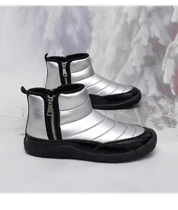 Detail of silver quilted winter boot with side zipper and thick non-slip rubber sole