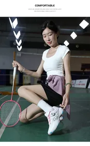 Detail of white professional badminton shoes featuring convenient rotary buckle closure system