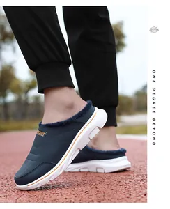 Detail of blue men's winter slippers with plush lining and white shock-absorbing sole