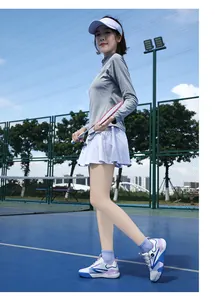Outdoor sports set with grey top and purple detail shoes on a professional court