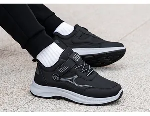 Detail of breathable black mesh walking shoes with side logo and non-slip sole grip