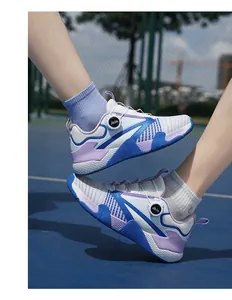 Detail of breathable athletic shoe with dial lacing system and purple accents