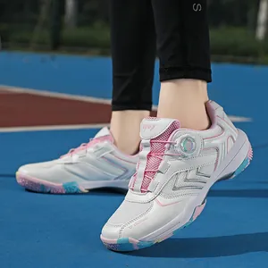 Women's professional indoor court shoes with pink accents and a rotary buckle system