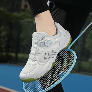 White professional badminton shoes with carbon plate and rotary dial on blue racket