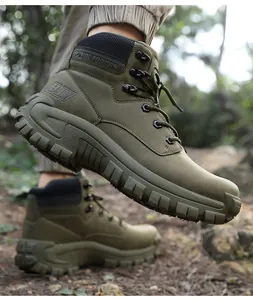Close-up of olive green tactical hiking boot with heavy-duty rubber sole and HJV logo