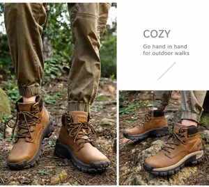 Detail view of brown high-top hiking boots with thick rubber soles and textured leather