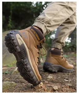 Detailed view of durable rubber outsole and brown nubuck leather on men's hiking boots