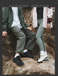 Outdoor hiking shoes with thick soles and anti-slip traction shown on rocky terrain