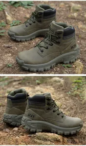 Detail view of army green tactical hiking boots with non-slip sole in a rugged forest terrain