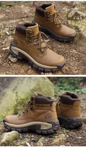 Detail view of brown tactical hiking boots with non-slip soles and metal eyelets