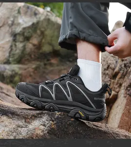 Macro detail of breathable black outdoor hiking shoes with durable thick anti-slip soles
