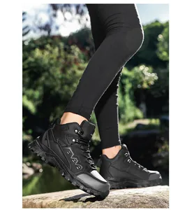 Detail of durable black outdoor hiking boots with textured rubber sole for grip