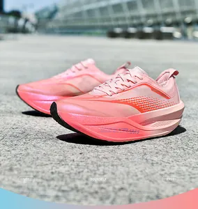 Detail of pink breathable mesh running shoes with thick curved cushioned soles for comfort