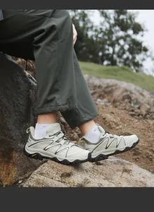 Detail shot of off-white hiking shoe with thick anti-slip sole and outdoor branding