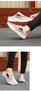 Dettaglio scarpa da camminata in mesh rosa traspirante con chiusura a velcro regolabile