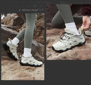 Detail of beige outdoor hiking shoes featuring mountain lines and a thick rubber sole