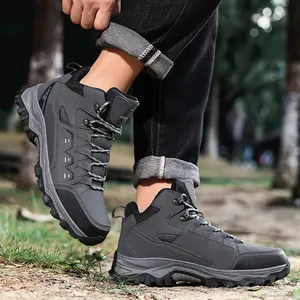 Deep grey mid-top outdoor hiking boots with durable rubber soles for men and women